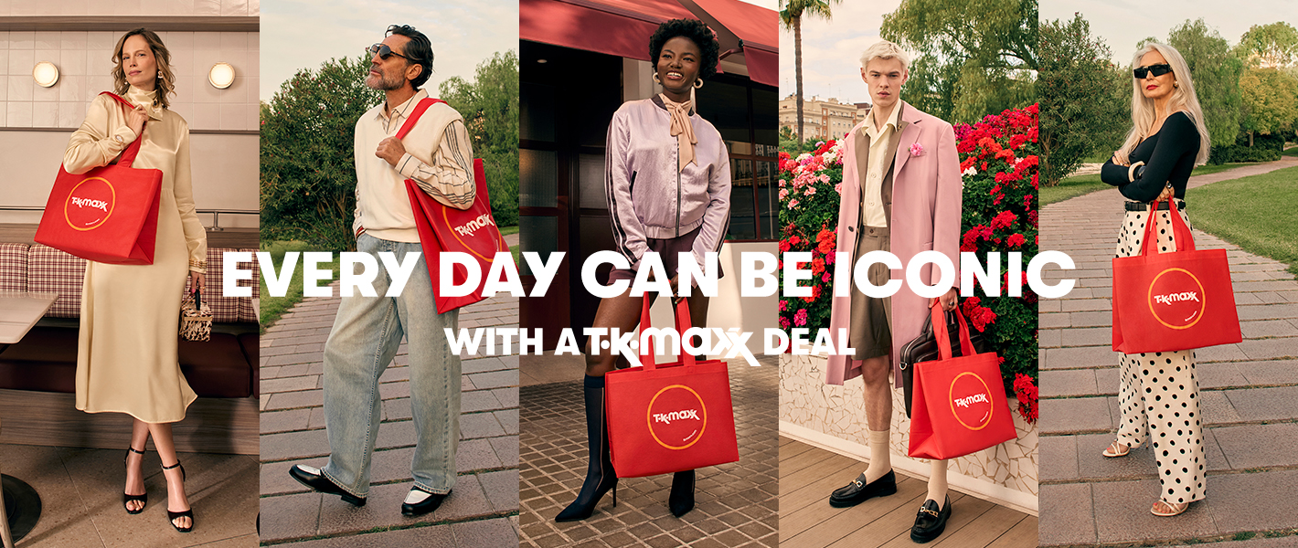 A lineup of five people standing outdoors and indoors in different stylish outfits, each carrying a large red TK Maxx shopping bag. Bold white text across the centre reads “EVERY DAY CAN BE ICONIC WITH A TK MAXX DEAL.” A red button below says “WATCH THE NEW AD.”